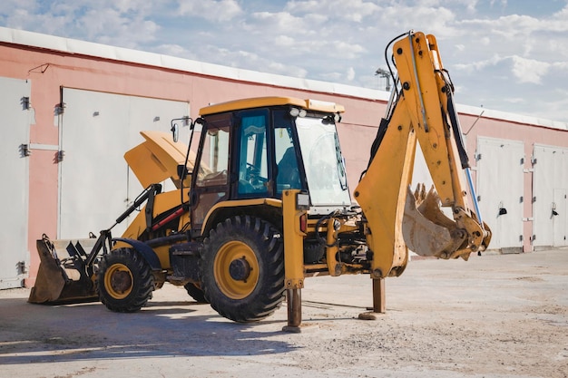 Repair of a broken excavator. Excavator without a wheel. Breakdown of a construction loader during operation.