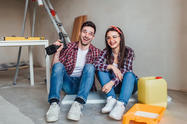 Repair, building, renovation and home concept, Couple doing repair at home