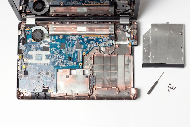 Repair concept with details of disassembled laptop