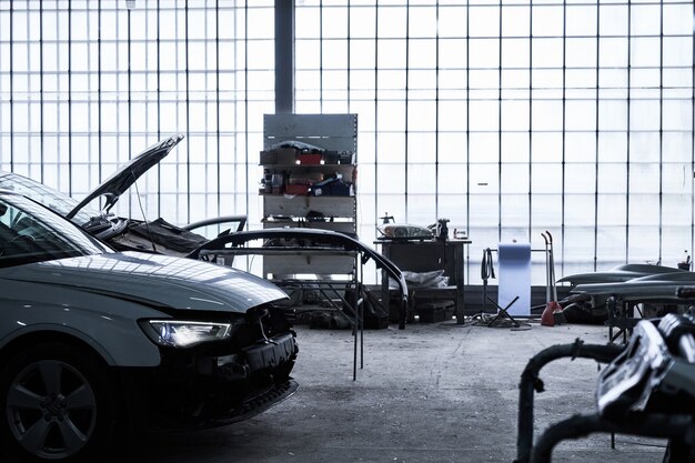 Photo repair of an old broken car at auto service