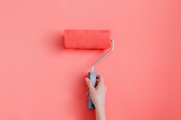 Repair painting the walls in a trendy living coral color