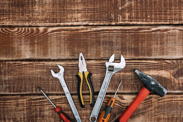 repair tools, flat lay. Hammer, pliers, wrench, screwdriver.