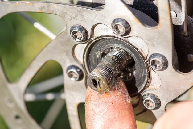 Repairing and cleaning details in bikes wheel maintenance of transport at home