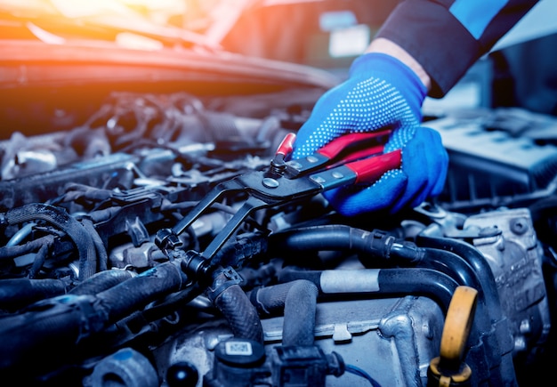 Repairing engine at service station. Car repair.