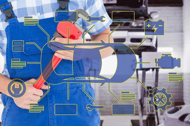 Repairman holding adjustable pliers against auto repair shop