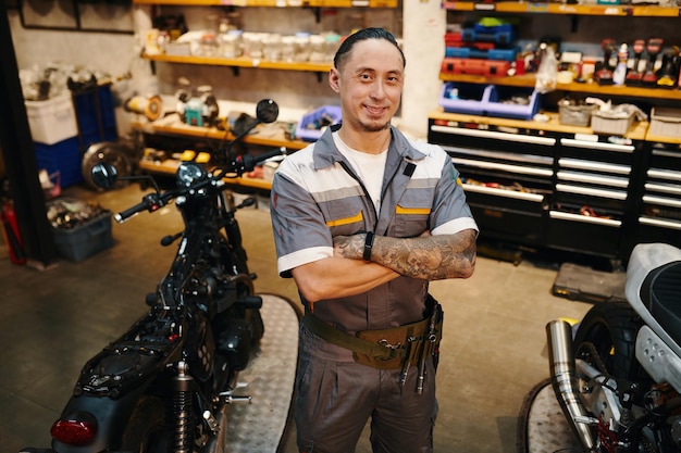 Repairman working in motorcycle garage