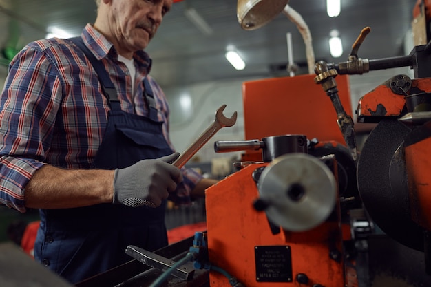 Repairman working with work tool