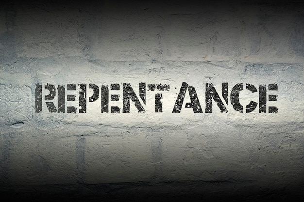 Repentance stencil print on the grunge white brick wall