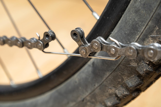 Photo replacing a chain link on a bicycle bicycle chain link lock