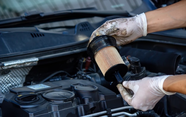 Replacing the oil filter on the car.