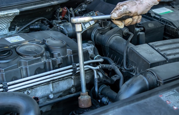 Replacing the oil filter on the car.