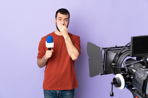 Reporter man over isolated purple background