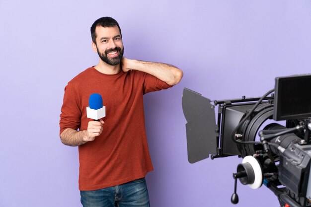 Reporter man over isolated purple background