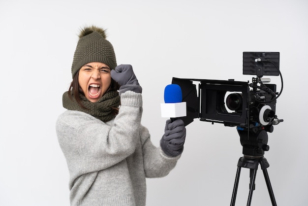 Reporter woman holding a microphone and reporting news isolated