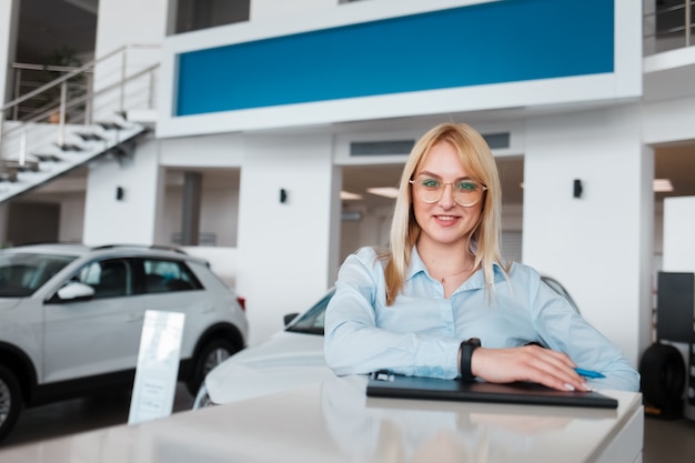 Representative of the car dealership is behind the reception