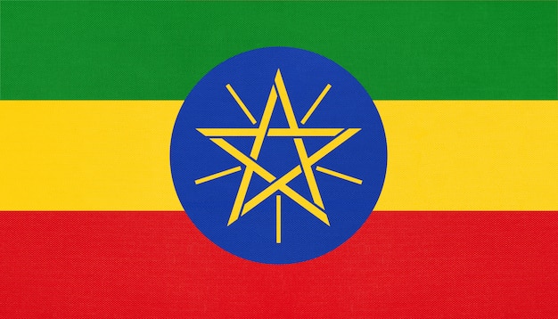 Photo republic of ethiopia national fabric flag, textile background. symbol of world african country.