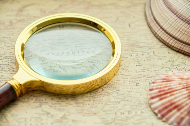 Republic of kazakhstan on map through magnifying glass, travel,
vacation and recreation.sunny country.