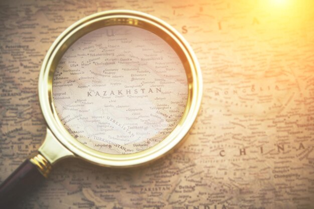 Republic of kazakhstan on map through magnifying glass, travel,
vacation and recreation.sunny country.