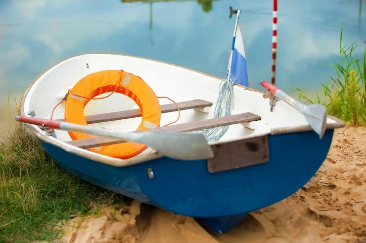Rescue boat on the water with a life buoy and oars