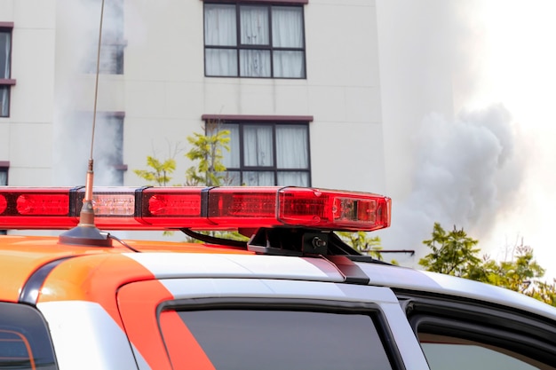 Rescue car at burning fire building.