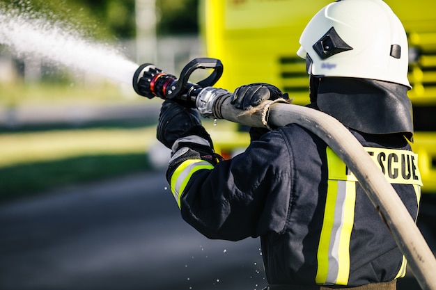 Rescue Firefighter man battle a wildfire. 