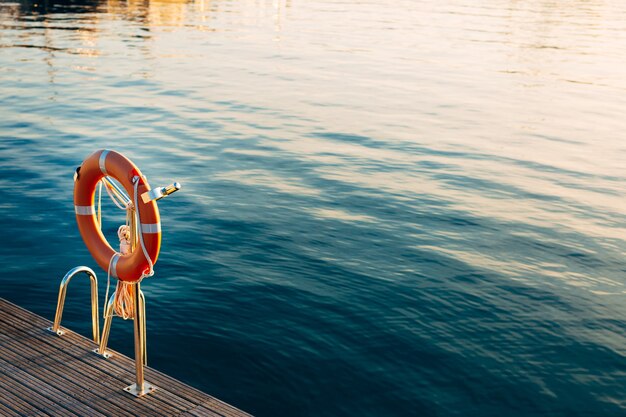 Rescue red circle on the seashore in the territory of porto montenegro