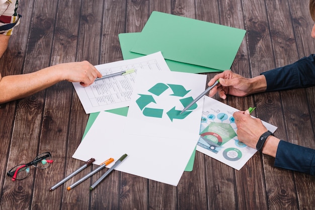 Photo rescue team making discussion on recycle wooden desk