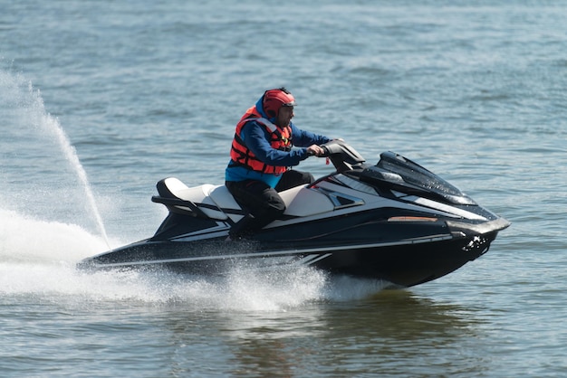 Rescuer Inspecting Ocean Area by Jet Ski