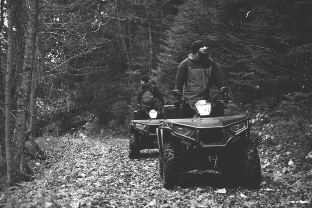 Rescuers Inspecting Woods Area by Atv Quad Bike