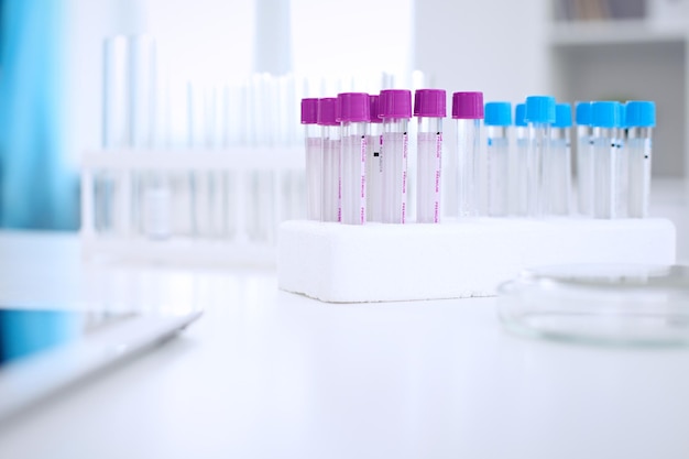 Research laboratory working space Test tubes and tablet PC are lying at the table