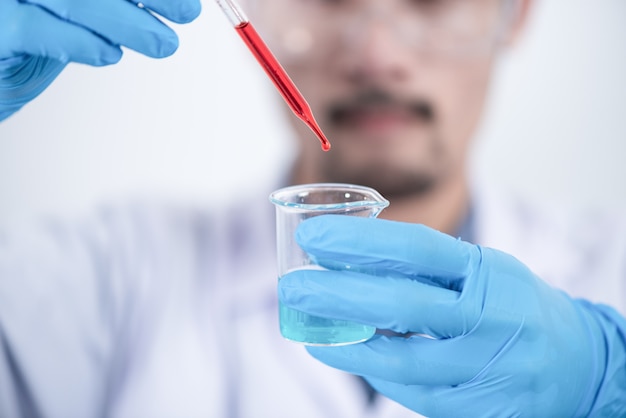 Researcher in the laboratory Studying with chemicals And microscopes