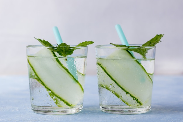 Resh cool detox drink with cucumber, lemonade in a glass with a mint