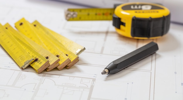 Residential building drawings and pencil on an office desk Construction concept