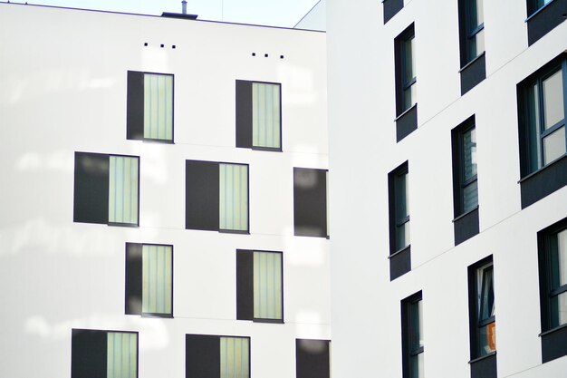 Residential building on sky background facade of a modern housing construction with of balconies