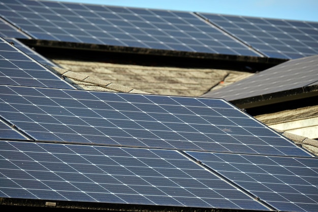 Residential house with rooftop covered with solar photovoltaic\
panels for producing of clean ecological electrical energy in\
suburban rural area concept of autonomous home