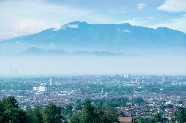 Residential houses in misty mountain background