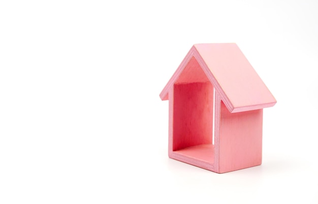 Residential Property idea with small pink house on white background