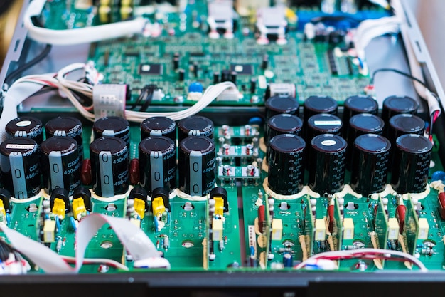 Resistors, capacitors and other electronic components of micro chip inside the computer close up