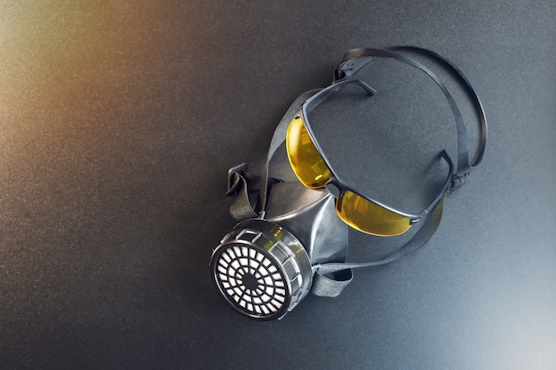 Respirator and yellow glasses on a table