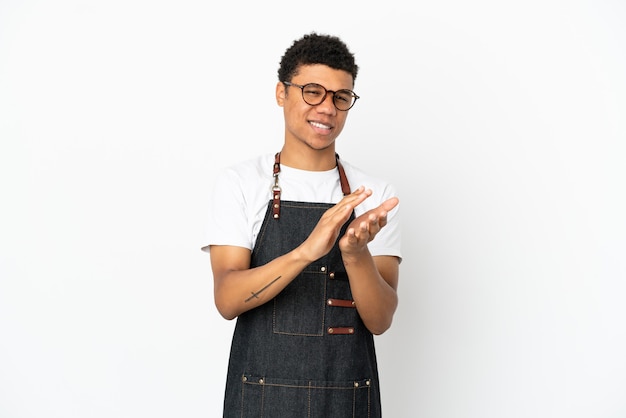 Restaurant African American waiter man isolated on white background applauding after presentation in a conference