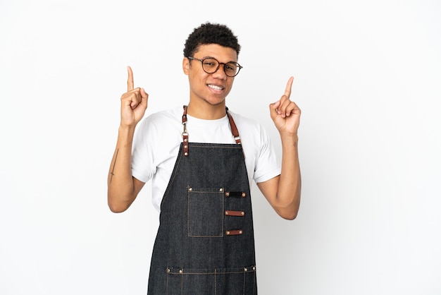 Restaurant African American waiter man isolated on white background pointing up a great idea