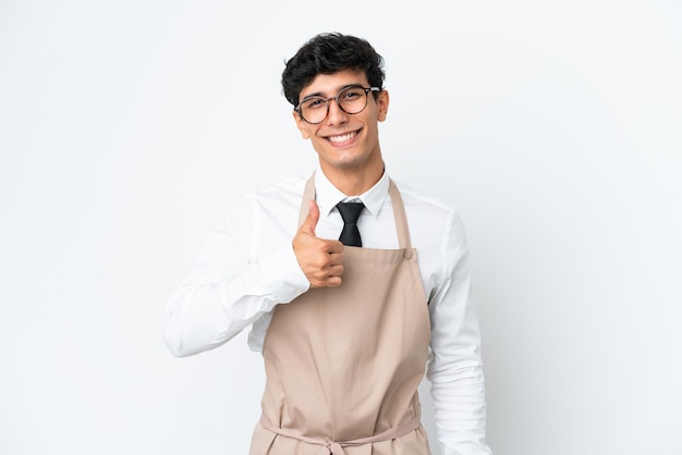 Restaurant Argentinian waiter isolated on white background giving a thumbs up gesture