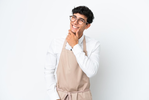 Restaurant Argentinian waiter isolated on white background with glasses and smiling