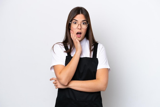 Restaurant Brazilian waiter woman isolated on white background surprised and shocked while looking right