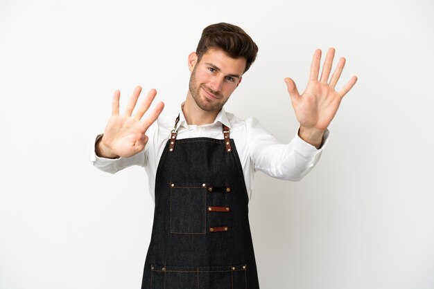 Restaurant caucasian waiter isolated on white background counting nine with fingers