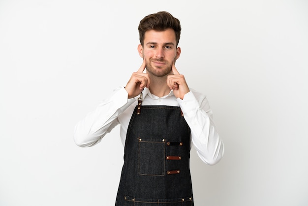 Restaurant caucasian waiter isolated on white background smiling with a happy and pleasant expression