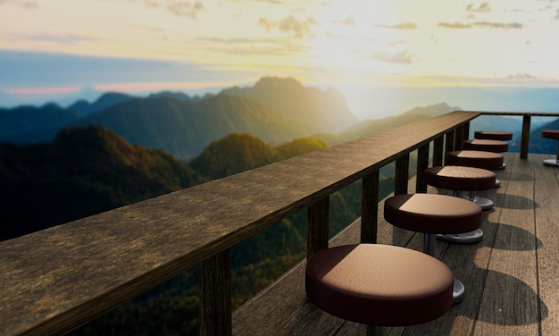 A restaurant or coffee shop has a mountainous landscape and some morning mist The sunlight on the top of the hill Balcony or terrace Plank floors and long tables made of wood and timber3d Rendering