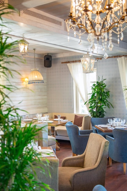 Restaurant and ingredient food on a white chair with a variety of wooden chairs