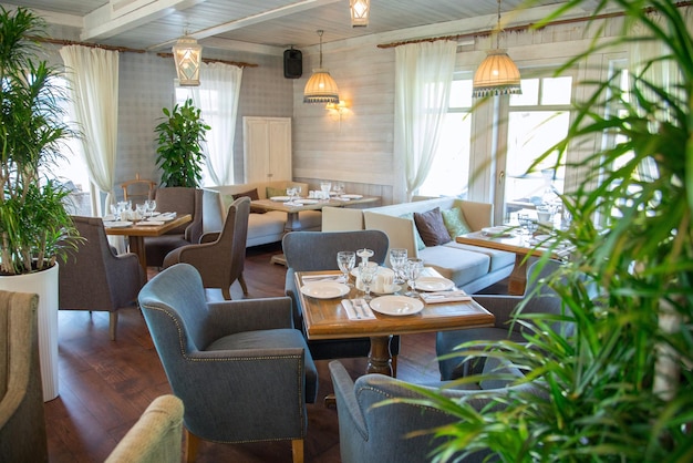 Restaurant and ingredient food on a white chair with a variety of wooden chairs