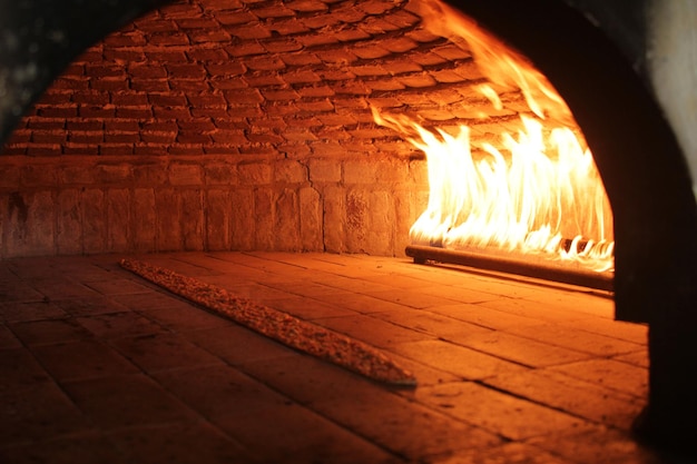 In a restaurant pita or pide bread cooking in oven or stove